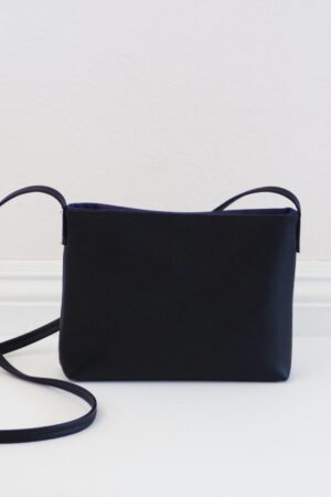 Sleek and Sophisticated The Minimalist Black Leather Crossbody Bag with Magnetic Closure