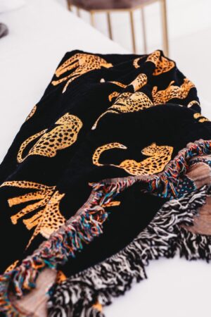 Unleash the Untamed Elegance Luxurious Leopard Throw for a Wildly Chic Home