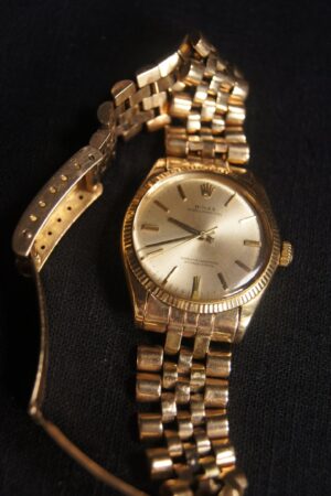 Vintage Rolex Oyster Perpetual A Timeless Treasure in 14K Gold (Circa 1965)