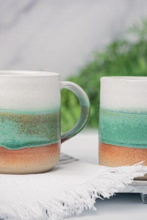 Artisan-Crafted Stoneware Mug An Enchanting Tapestry of White and Green