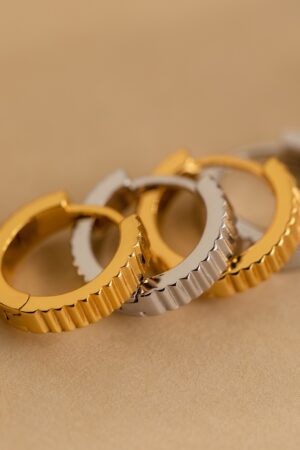 Golden Embrace Ribbed Huggie Hoops for a Timeless Allure