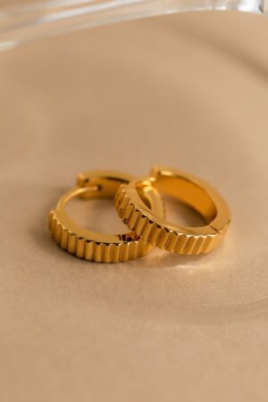 Golden Embrace Ribbed Huggie Hoops for a Timeless Allure