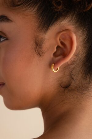 Golden Embrace Ribbed Huggie Hoops for a Timeless Allure