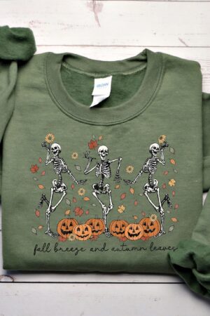 Fall into the Spooky Spirit with Our Dancing Skeletons Sweatshirt Embrace the Autumn Breeze and Autumn Leaves