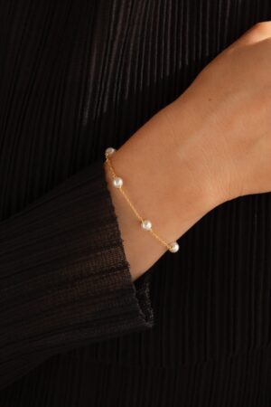 Caitlyn Minimalist's Pearl Station Bracelet A Delicate Charm of Pearls and Gold