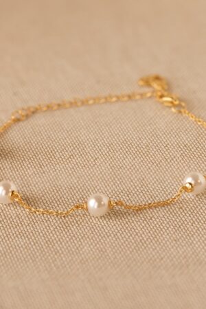 Caitlyn Minimalist's Pearl Station Bracelet A Delicate Charm of Pearls and Gold