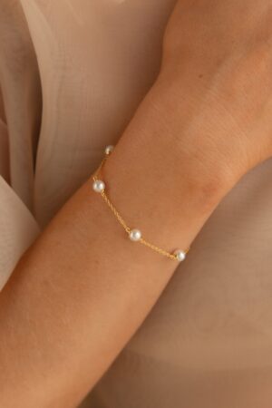 Caitlyn Minimalist's Pearl Station Bracelet A Delicate Charm of Pearls and Gold