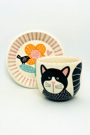 Enchanting Ceramic Cup and Saucer A Feline Fantasy with a Bird and Bloom