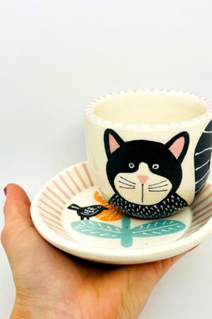 Enchanting Ceramic Cup and Saucer A Feline Fantasy with a Bird and Bloom