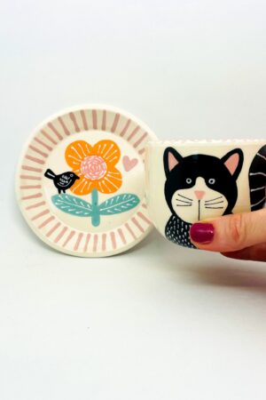 Enchanting Ceramic Cup and Saucer A Feline Fantasy with a Bird and Bloom