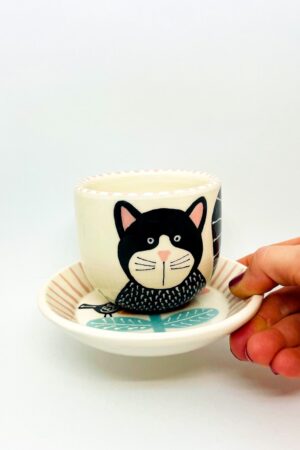 Enchanting Ceramic Cup and Saucer A Feline Fantasy with a Bird and Bloom