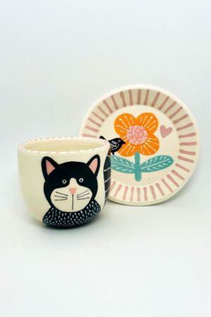 Enchanting Ceramic Cup and Saucer A Feline Fantasy with a Bird and Bloom