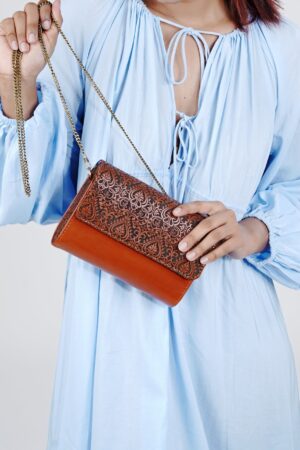 Exquisitely Crafted Orange Leather Sling Bag A Symphony of Teak Wood and Hand-Tooled Art