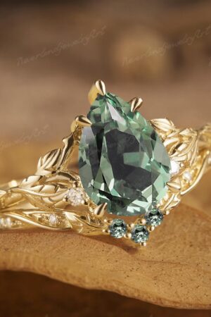 Nature's Embrace Vintage Pear Cut Green Sapphire Engagement Ring Set with Leaf-Inspired Wedding Band