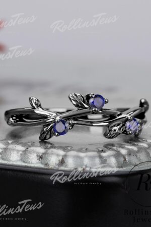 Nature's Embrace Blue Sapphire and Black Gold Twig Ring, a Symbol of Love and Growth