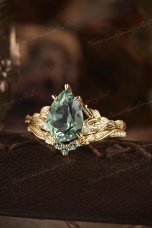 Nature's Embrace Vintage Pear Cut Green Sapphire Engagement Ring Set with Leaf-Inspired Wedding Band