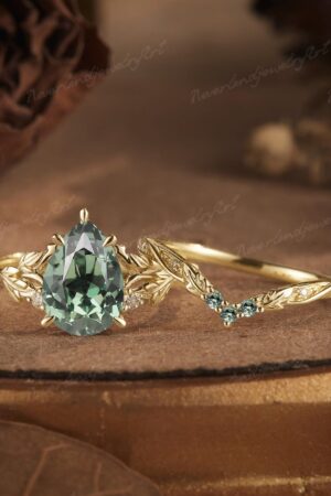 Nature's Embrace Vintage Pear Cut Green Sapphire Engagement Ring Set with Leaf-Inspired Wedding Band